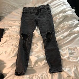 Free people black jeans with rips in knees